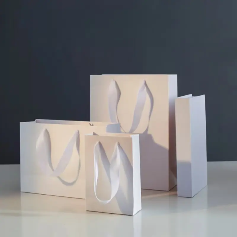 Paper bags with ribbon handles