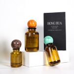 Amber Round Perfume Bottle 30ml 50ml 100ml With Ball Shape Cap | Honghua Glass