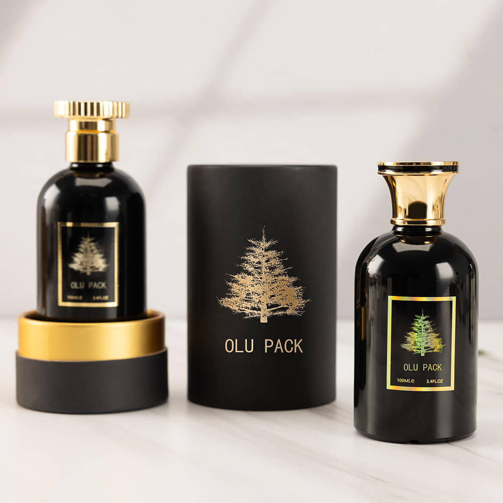 Frasco de perfume negro con estampado dorado de lujo y caja de regalo